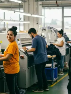 Workers in a modern, ethical textile factory, demonstrating fair labor practices and safe working conditions.