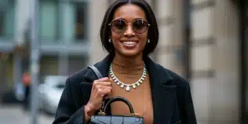 Stylish woman demonstrating the art of accessorizing 2026 outfits with three key items.